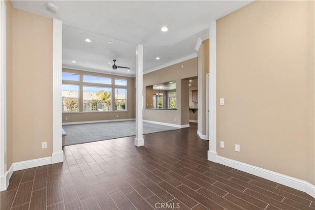 unfurnished room with ornamental molding and ceiling fan