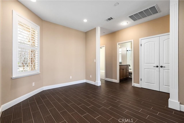 empty room with dark hardwood / wood-style floors