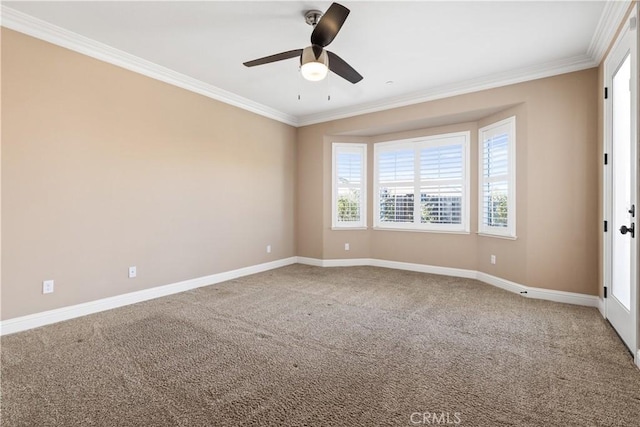 spare room featuring ceiling fan, ornamental molding, and carpet floors