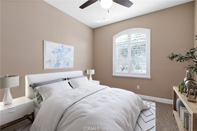 bedroom with ceiling fan and carpet flooring