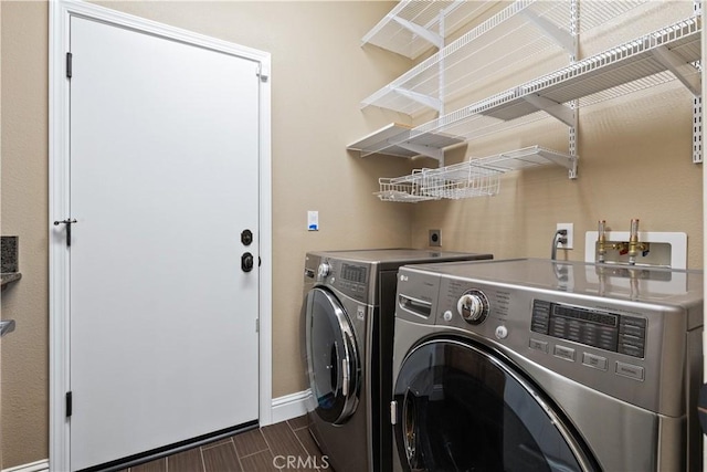 washroom with independent washer and dryer