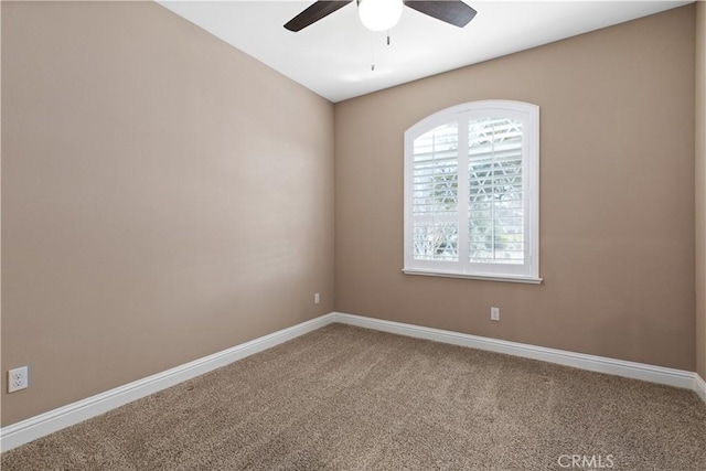 empty room featuring carpet floors and ceiling fan