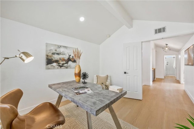 home office featuring lofted ceiling with beams and light wood-type flooring