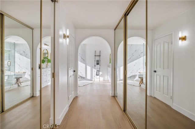 hall with light wood-type flooring