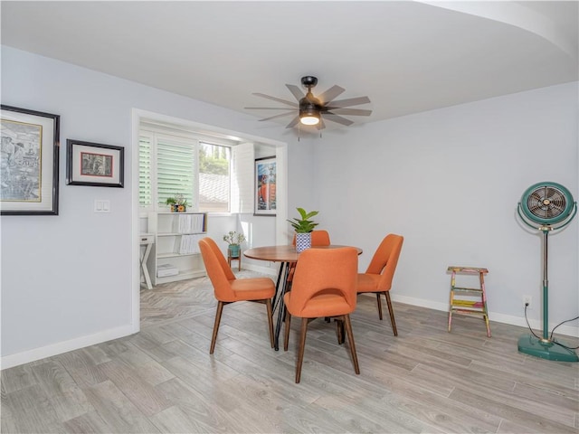 dining room featuring ceiling fan and light hardwood / wood-style flooring