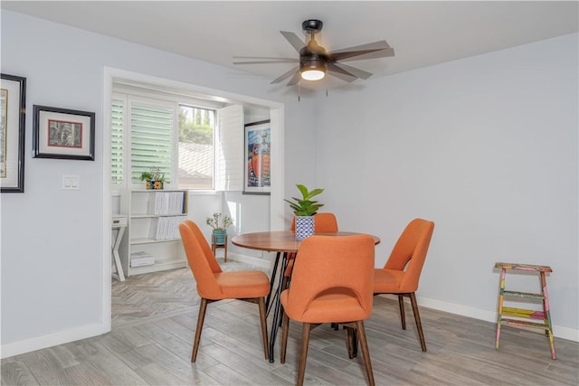 dining room featuring ceiling fan and light hardwood / wood-style floors