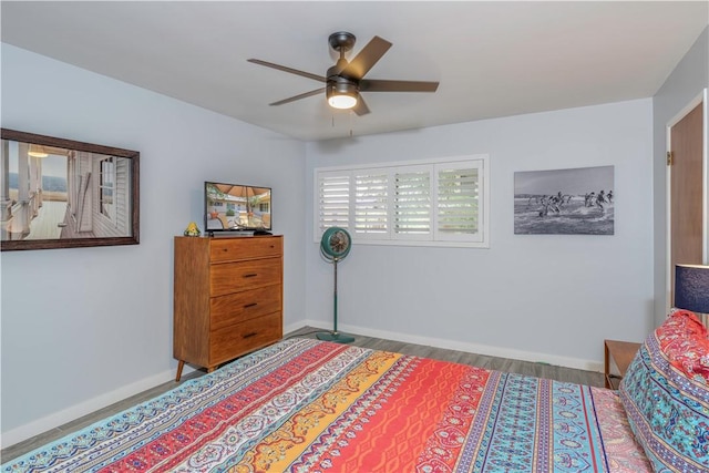 bedroom featuring hardwood / wood-style floors and ceiling fan