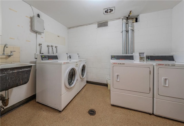 laundry room featuring separate washer and dryer