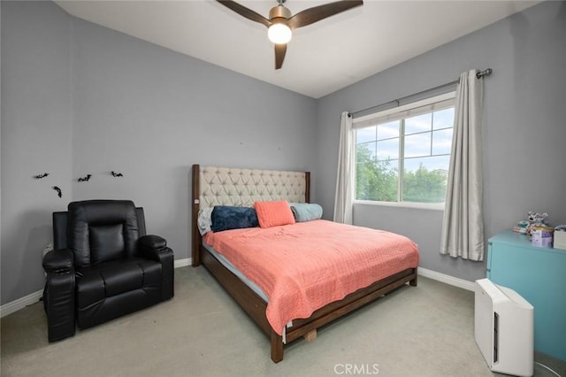 bedroom featuring ceiling fan and light colored carpet