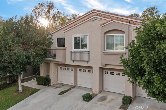 multi unit property featuring a garage