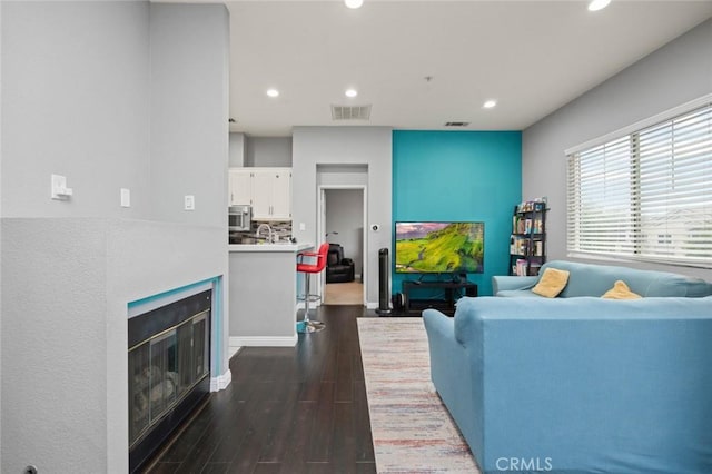 living room with dark hardwood / wood-style floors