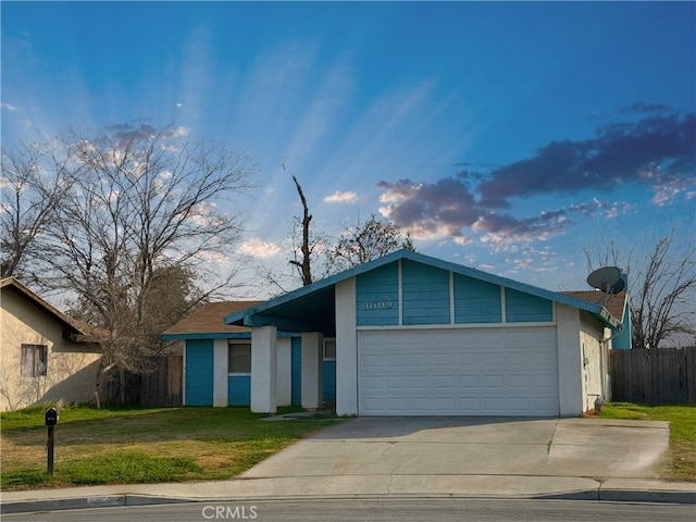 ranch-style home with a garage and a front yard