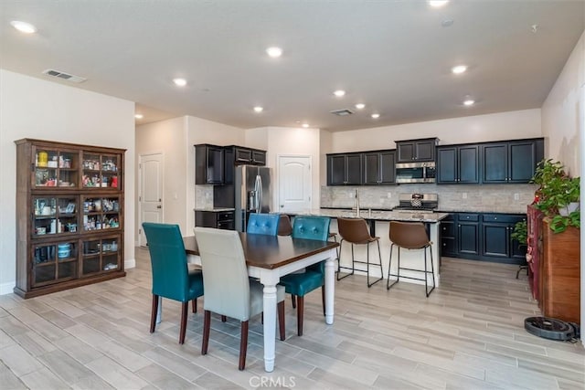 315 Timberline Way S, Madera, CA 93636 - dining area with light wood-type flooring, recessed lighting, and baseboards