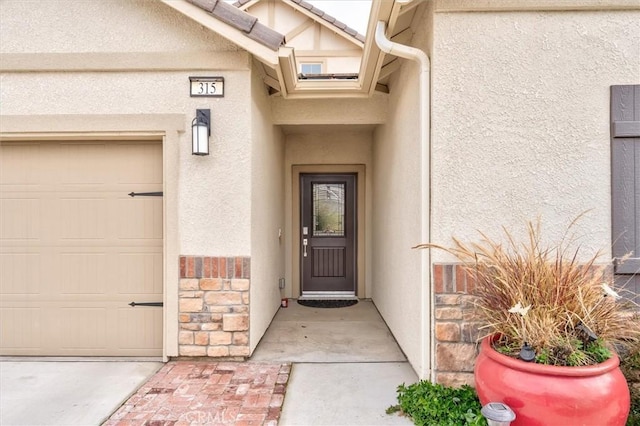 315 Timberline Way S, Madera, CA 93636 - property entrance with stucco siding and stone siding