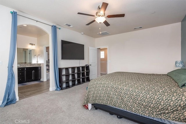 315 Timberline Way S, Madera, CA 93636 - bedroom with carpet, arched walkways, and a ceiling fan