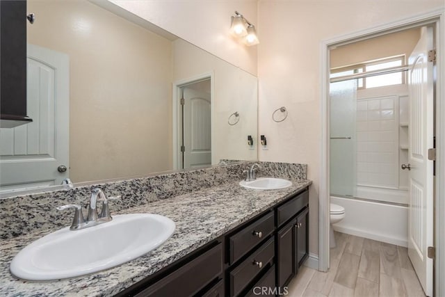 315 Timberline Way S, Madera, CA 93636 - full bath with double vanity, toilet, and combined bath / shower with glass door