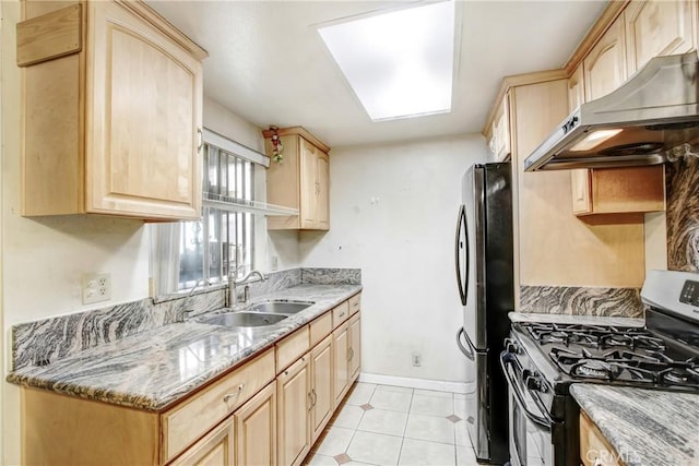 kitchen with stainless steel appliances, exhaust hood, and light brown cabinets