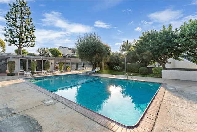 view of swimming pool featuring a patio area