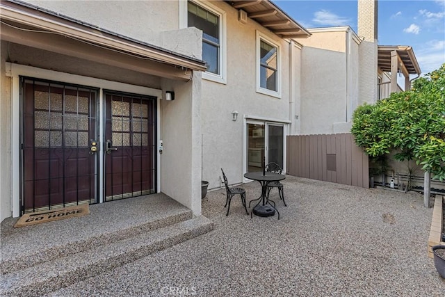 property entrance with a patio area