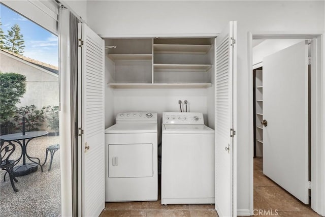 clothes washing area featuring independent washer and dryer