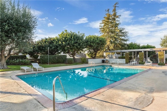 view of swimming pool with a patio area