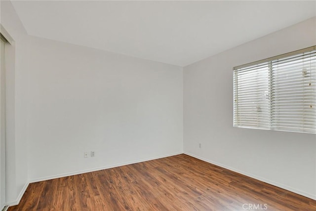 spare room featuring hardwood / wood-style flooring