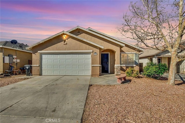 ranch-style house featuring a garage