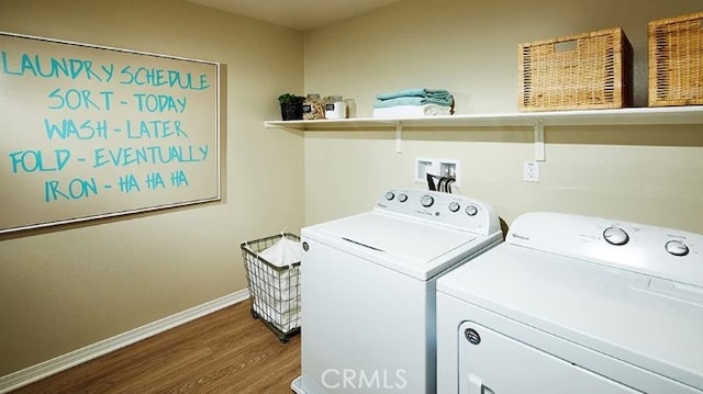 laundry room featuring hardwood / wood-style floors and independent washer and dryer