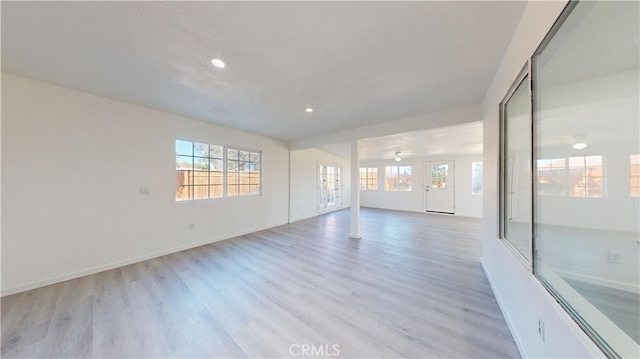 spare room with light hardwood / wood-style flooring