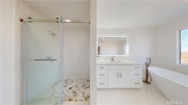 bathroom with vanity and independent shower and bath