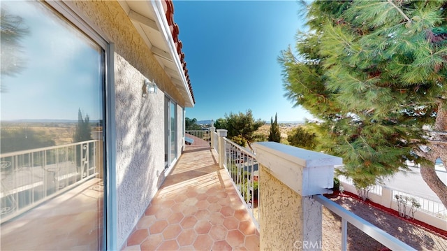 view of property exterior featuring a balcony