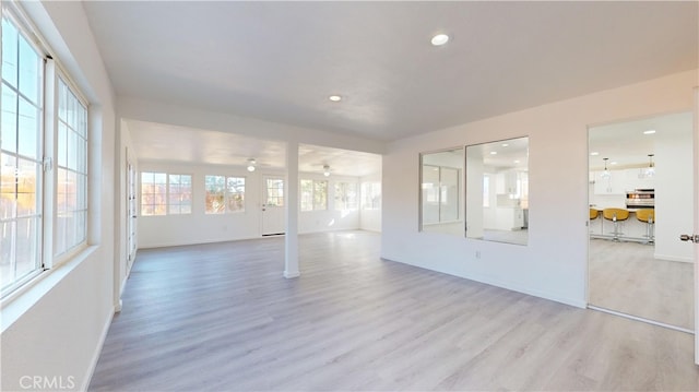 unfurnished room with light wood-type flooring