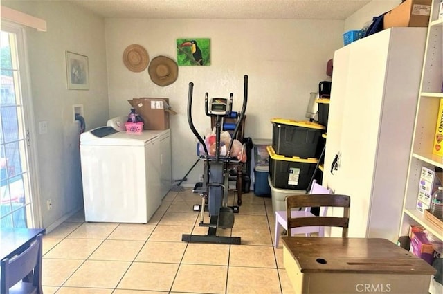 26302632 L St Unit A, B, C, Bakersfield, CA 93301 - exercise area featuring washer / dryer and light tile patterned flooring