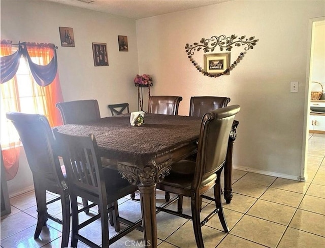 26302632 L St Unit A, B, C, Bakersfield, CA 93301 - dining area featuring light tile patterned floors and baseboards