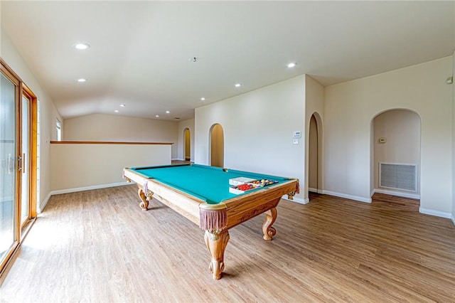 game room featuring lofted ceiling, pool table, and light wood-type flooring