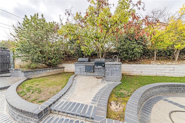 view of patio featuring a grill and exterior kitchen