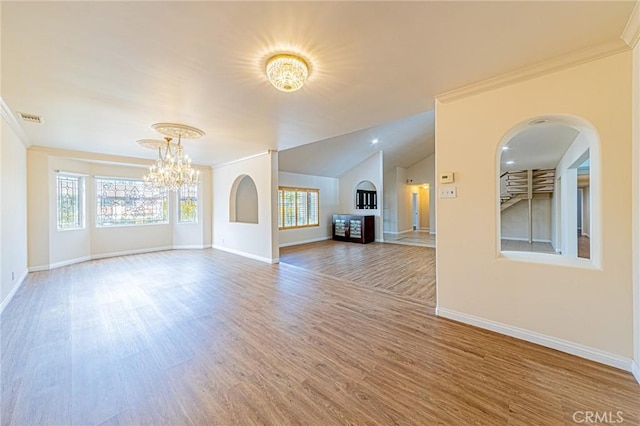 unfurnished living room with an inviting chandelier, wood-type flooring, crown molding, and vaulted ceiling