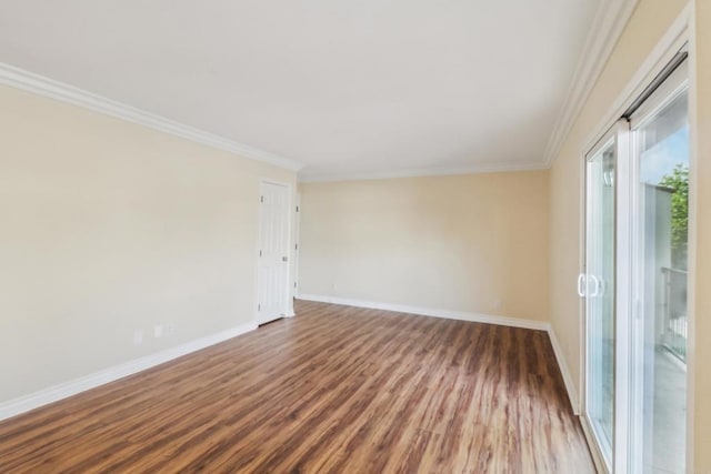 unfurnished room with ornamental molding and wood-type flooring