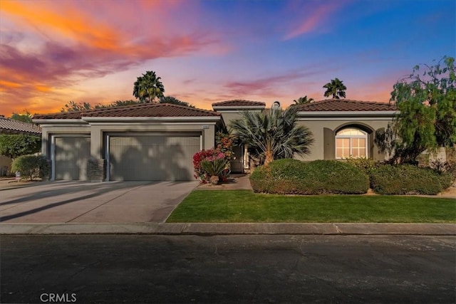 mediterranean / spanish-style house featuring a garage