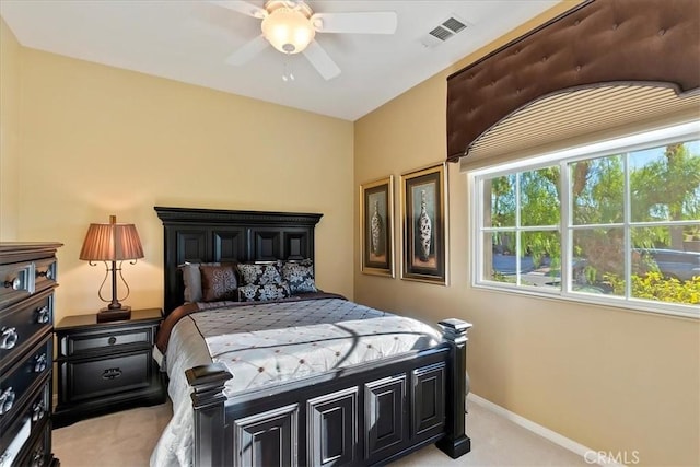 bedroom featuring light carpet and ceiling fan