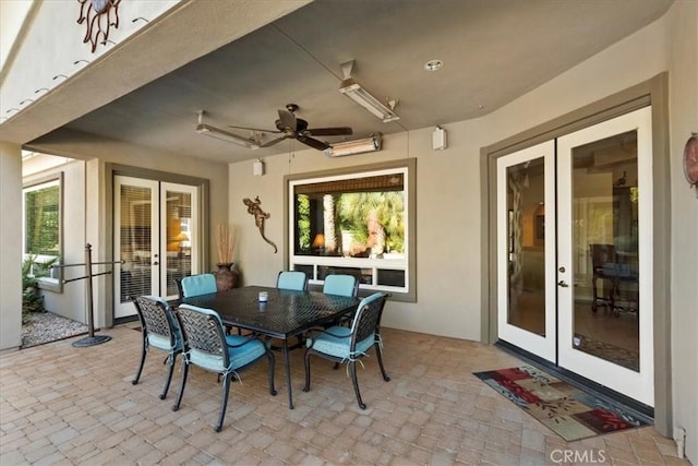 view of patio with french doors and ceiling fan