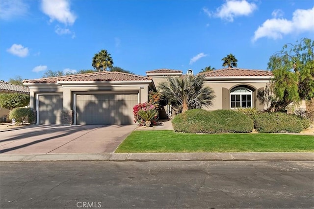 mediterranean / spanish house featuring a garage