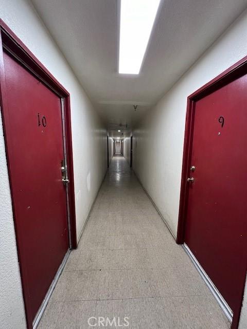 hallway featuring light floors