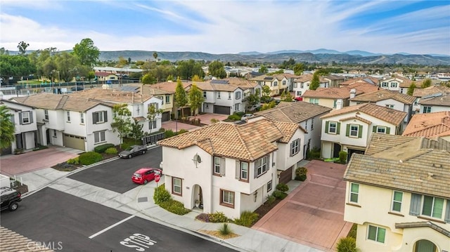 birds eye view of property with a mountain view