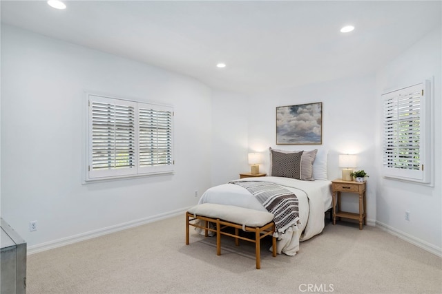 bedroom with light colored carpet