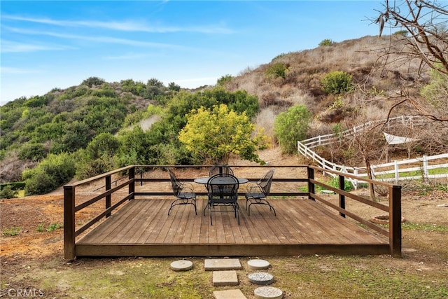 wooden terrace with a mountain view