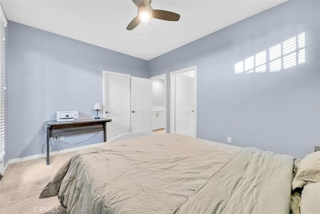 carpeted bedroom with baseboards and a ceiling fan