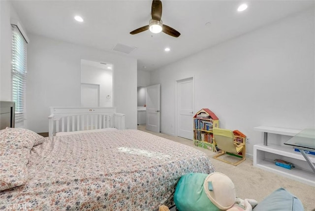 bedroom with a ceiling fan, recessed lighting, and light colored carpet