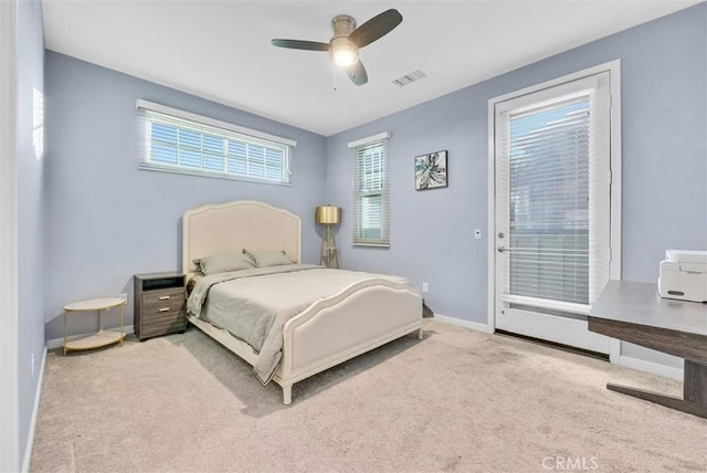 bedroom featuring visible vents, a ceiling fan, light carpet, access to outside, and baseboards