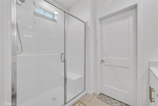 bathroom with a shower stall